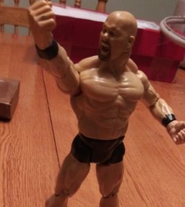 2 different stone cold Steve Austin action figures